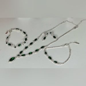 A sliver and emerald green jewelry set